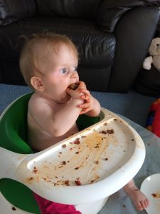 baby eating meatball