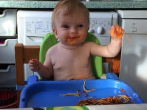 baby eating spaghetti bolognese