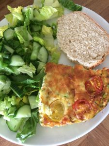 baked omelette with bread and salad